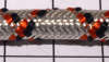 Шнур серебряный с оранжевым и черным.  Круглый 7 мм